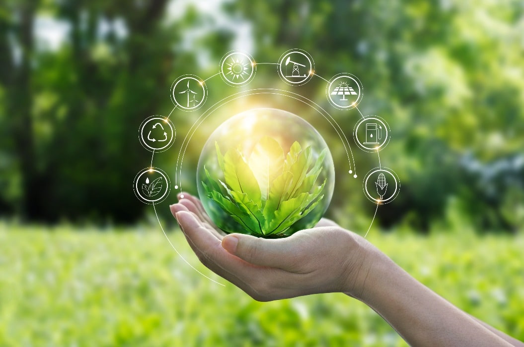 Hands protecting globe of green tree on tropical nature summer background, Ecology and Environment concept